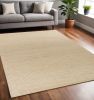 5' X 7' Tan And Ivory Hand Woven Area Rug