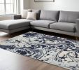 7' X 10' Blue And Ivory Abstract Area Rug