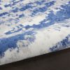 6' X 9' Ivory And Blue Ombre Distressed Area Rug