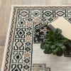 4' X 6' Ivory Black Orange And Gray Geometric Area Rug