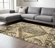 7' X 10' Tan And Gold Medallion Area Rug