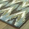 5' X 8' Gray And Taupe Ikat Pattern Area Rug