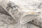 5' X 8' Gray and Ivory Abstract Power Loom Area Rug